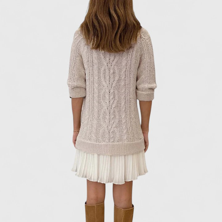 Ashlyndora sweater dress in apricot, back view showing pleated hem