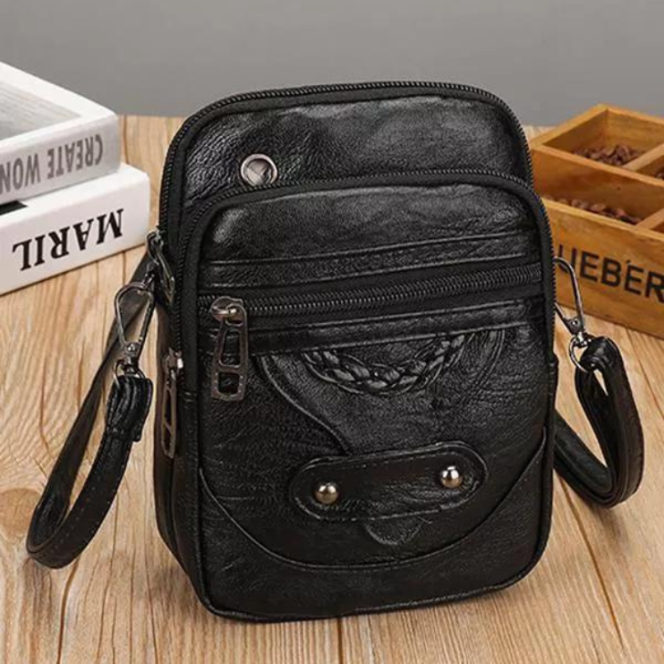Irena vintage crossbody bag in black, front view with stud flap