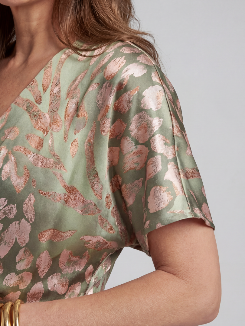 Coralie midi dress in green, close-up of print and short draped sleeve