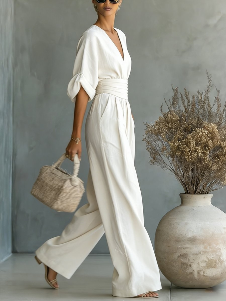 Sofia jumpsuit in white, side view with wide-leg trousers