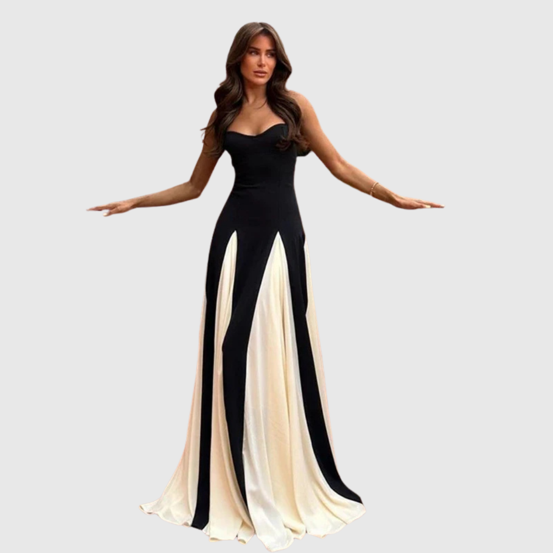 Alwen maxi dress in black and cream, model with arms outstretched