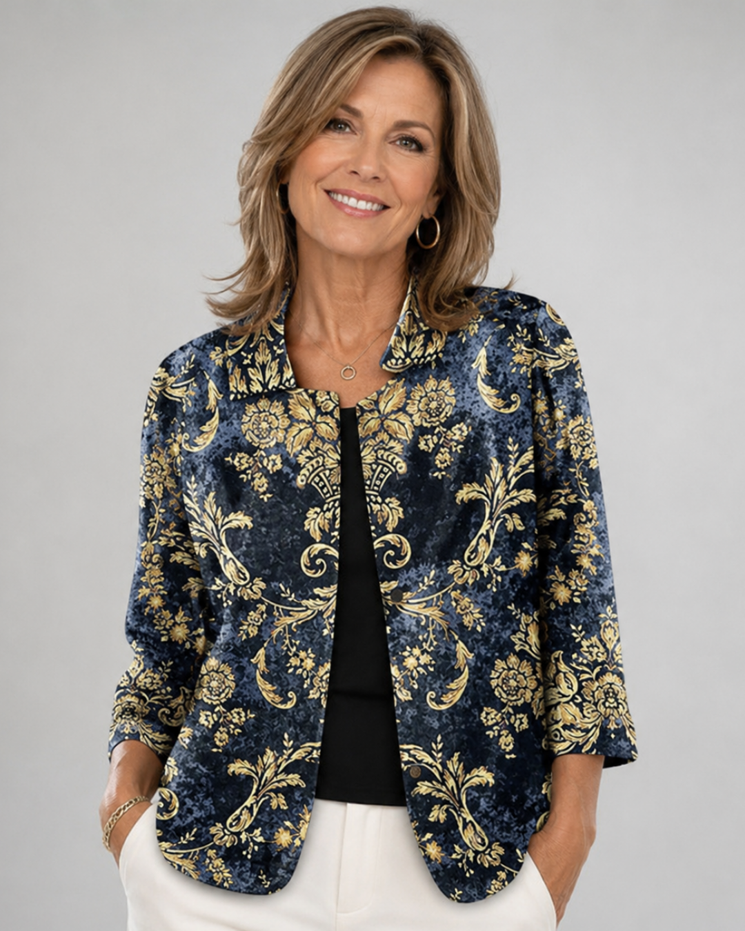Nolwen blouse in dark blue and gold baroque print, front view worn open over black