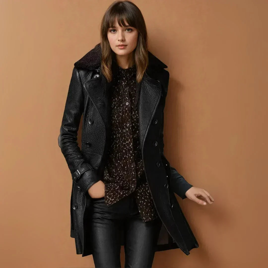Eirlys classic coat in black, front view against a warm backdrop