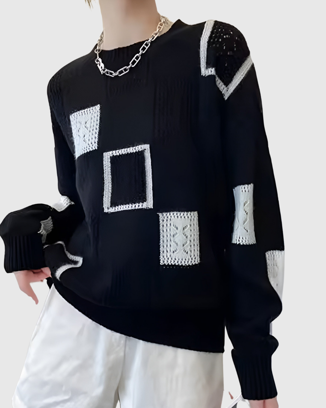 Vionelle chic sweater in black with white patchwork squares, front view