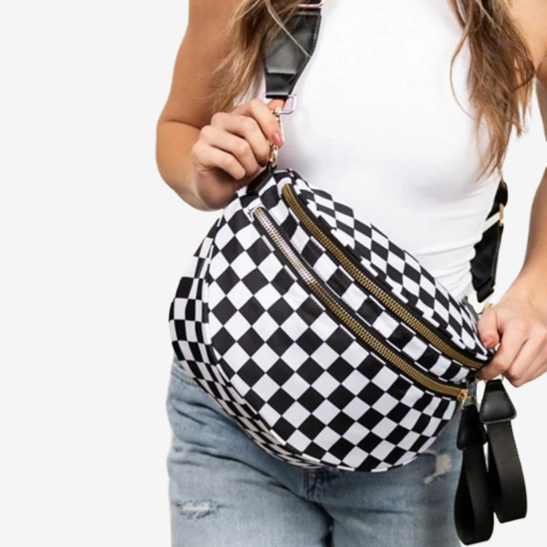 Dionne crossbody bag in black and white check, worn across the body