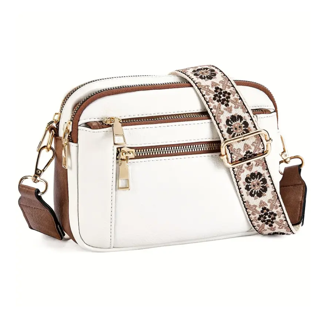 Strap crossbody bag in white with brown trim and woven strap