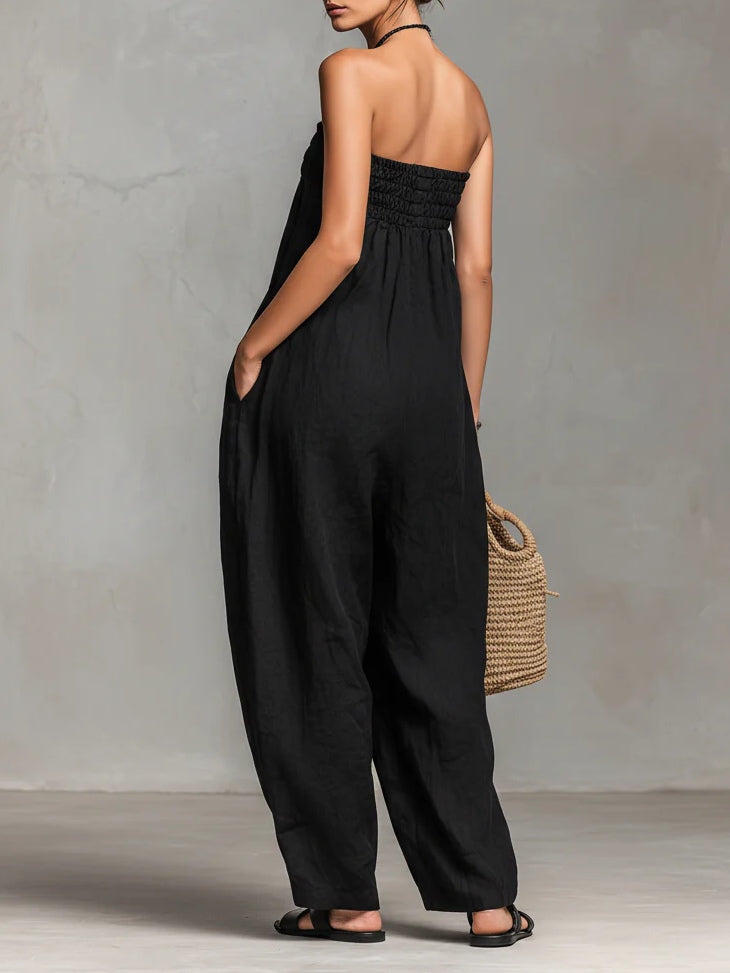 Nina strapless jumpsuit in black, back view showing shirred bandeau top