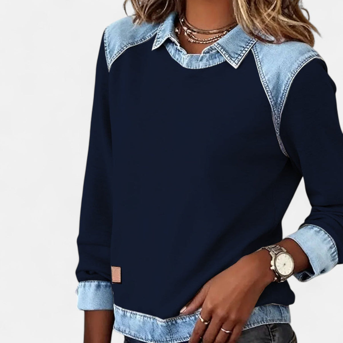 Zailah collared sweater in navy blue, close-up of shoulder and cuff detail