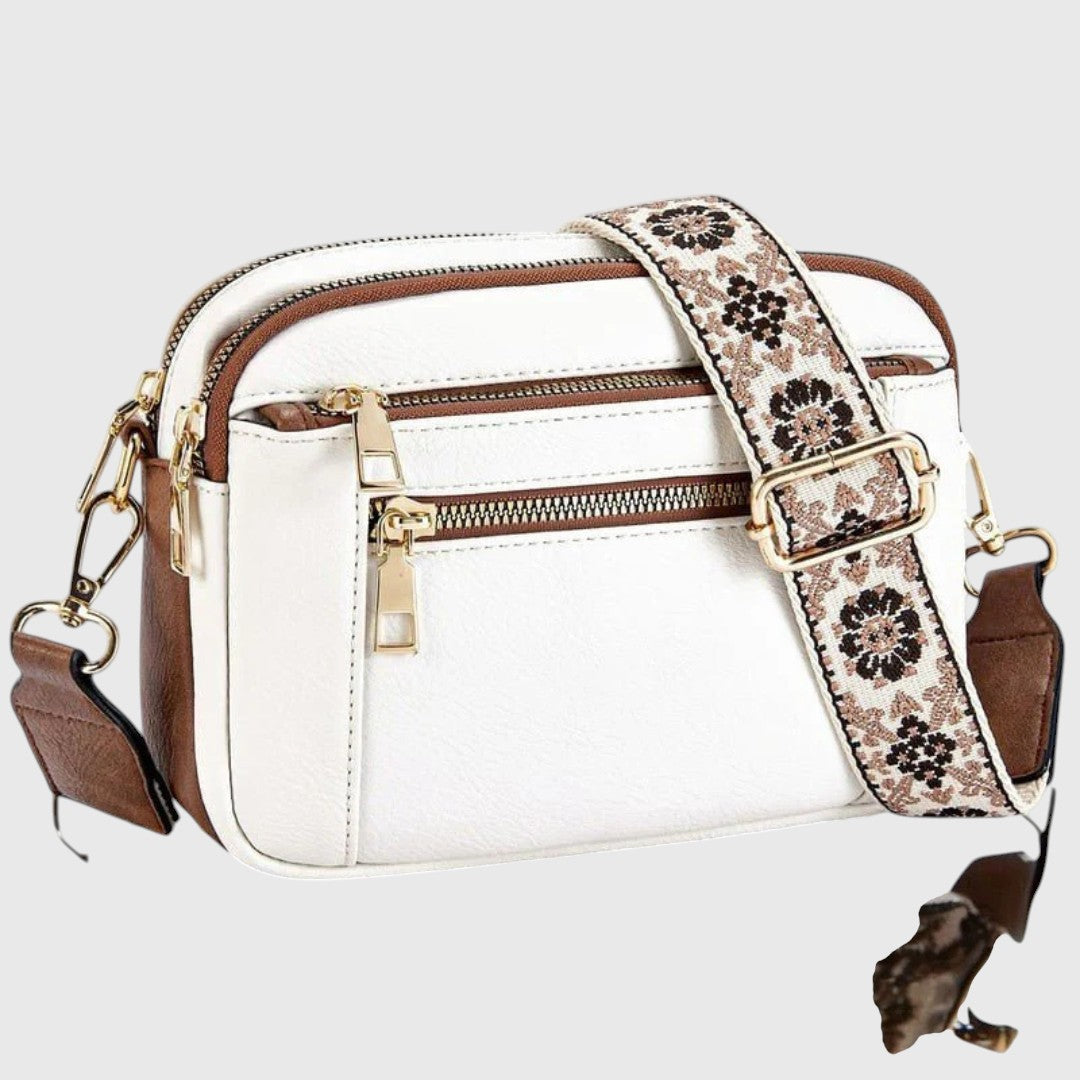 Dina shoulder bag in white with brown trim and floral strap, front view