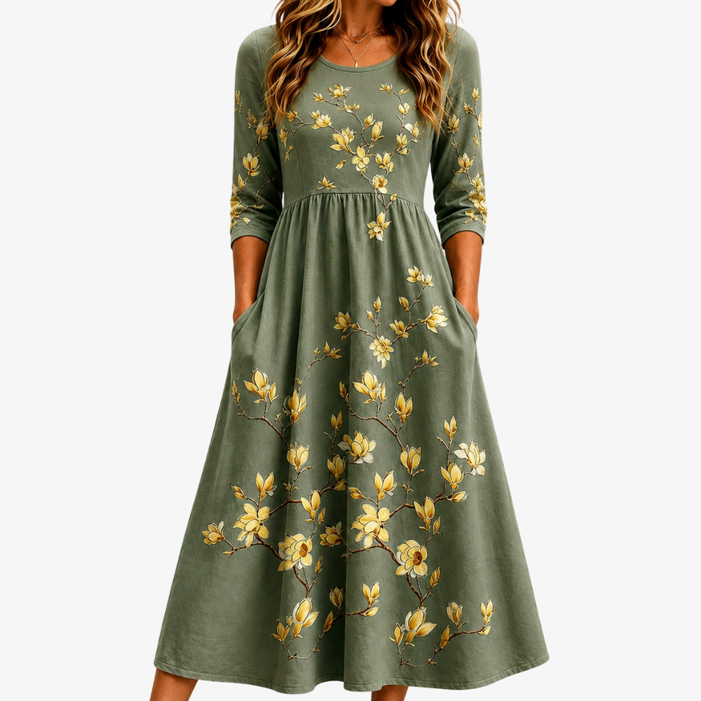 Sage green floral midi dress with golden blossom print and side pockets, front view