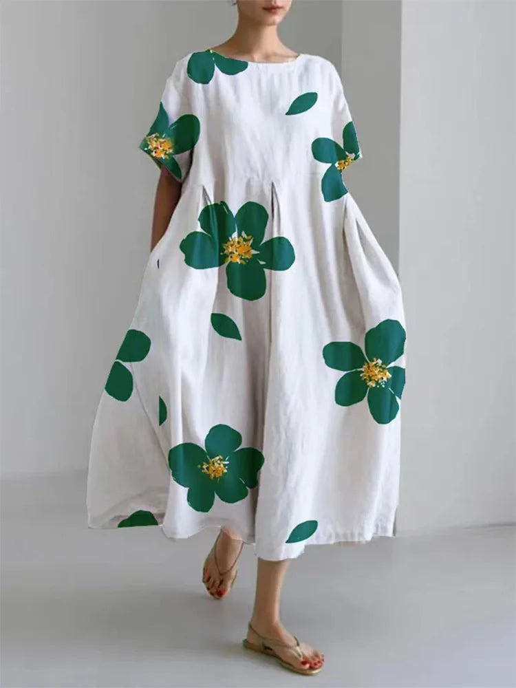 Mirabel floral summer dress in white with green flowers, walking front view