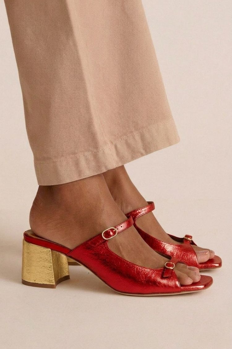 Red cut-out slingback heels with contrasting gold block heel, side view