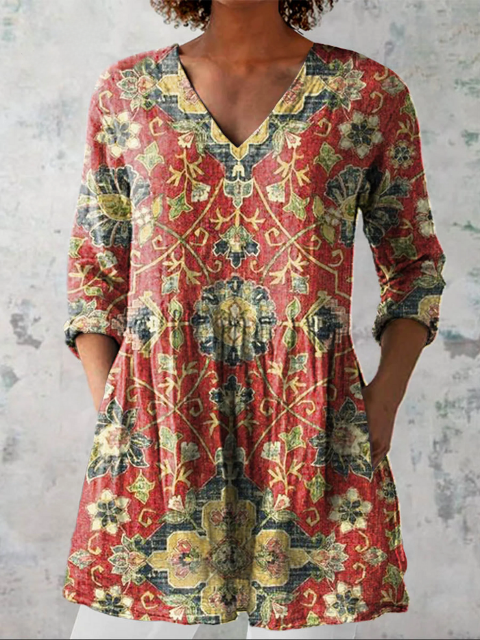 Lea long V-neck blouse in red multicolour print, front view worn with white trousers