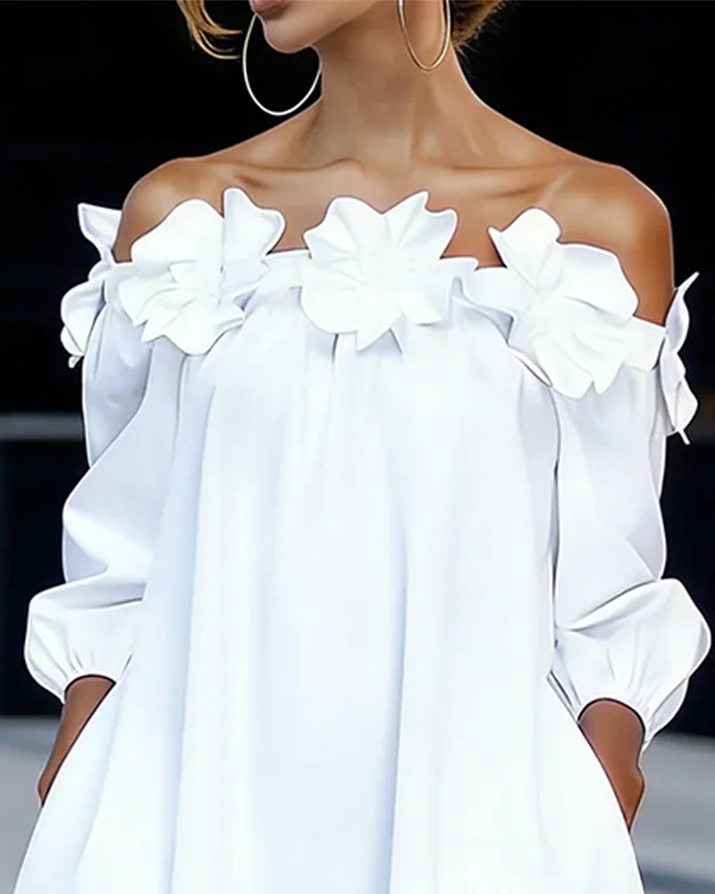 Rowena white dress, close-up of flower-trimmed off-shoulder neckline