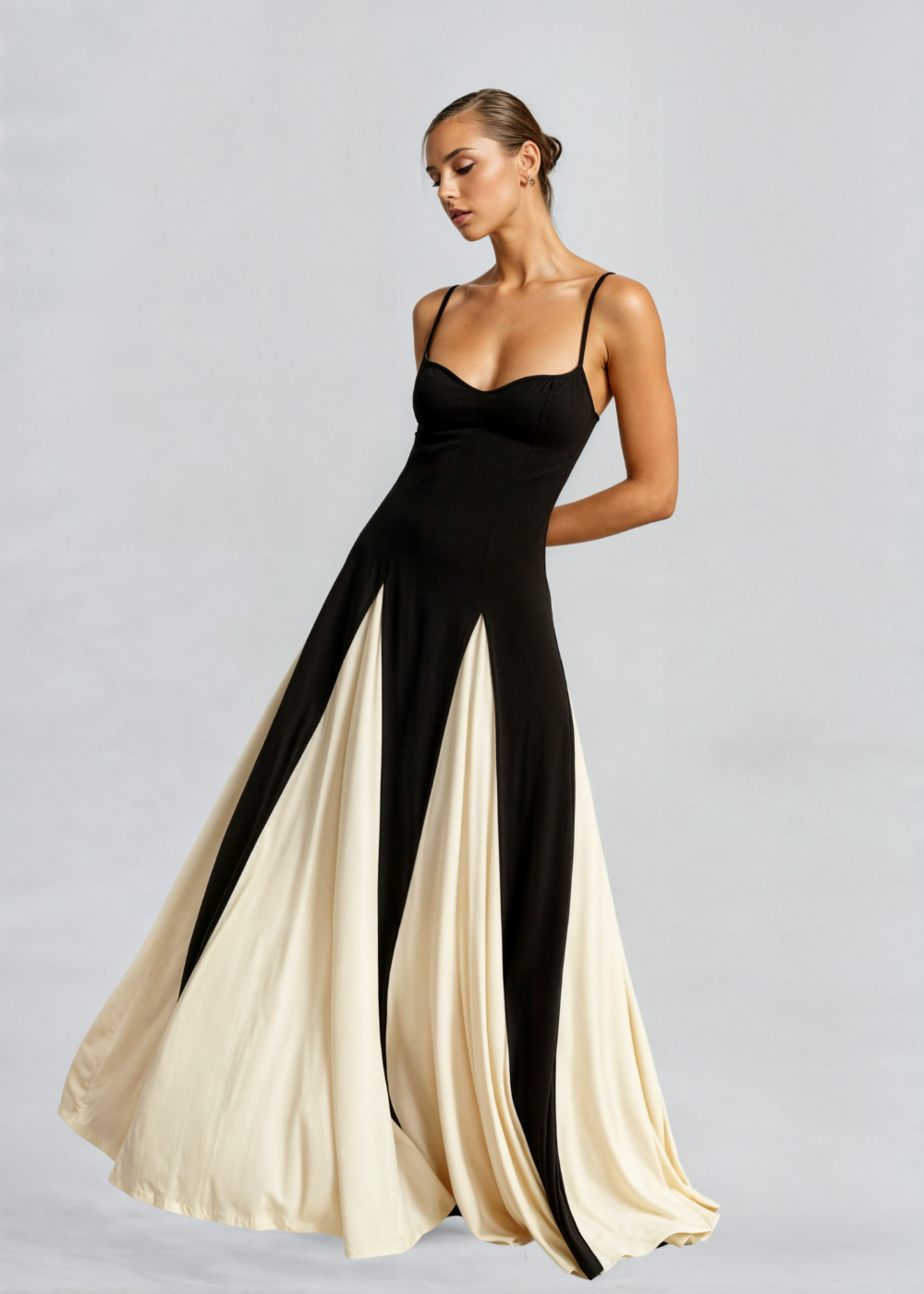 Alwen maxi dress in black and cream, side view showing panel skirt