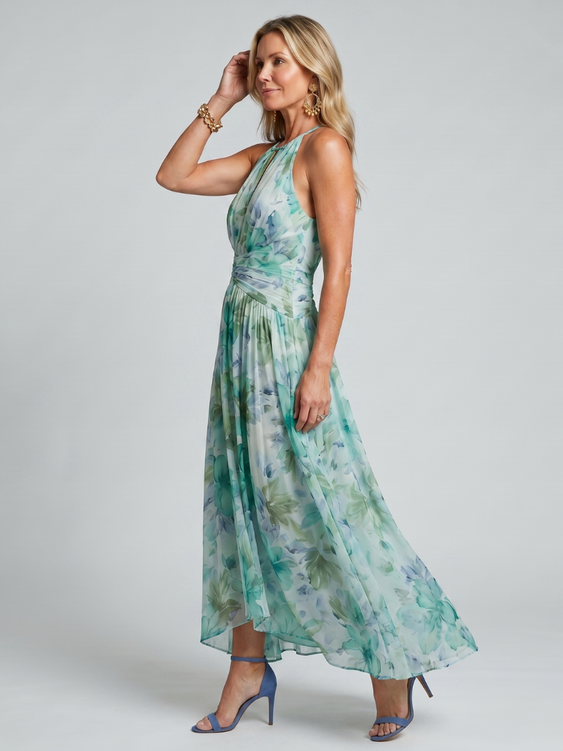 Portia halter midi dress in green floral, side view showing flowing skirt