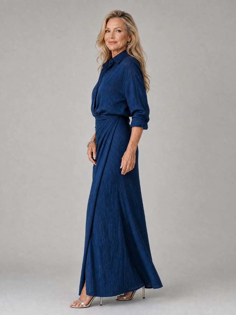 Mirque wrap front maxi dress in navy, side view showing draped skirt