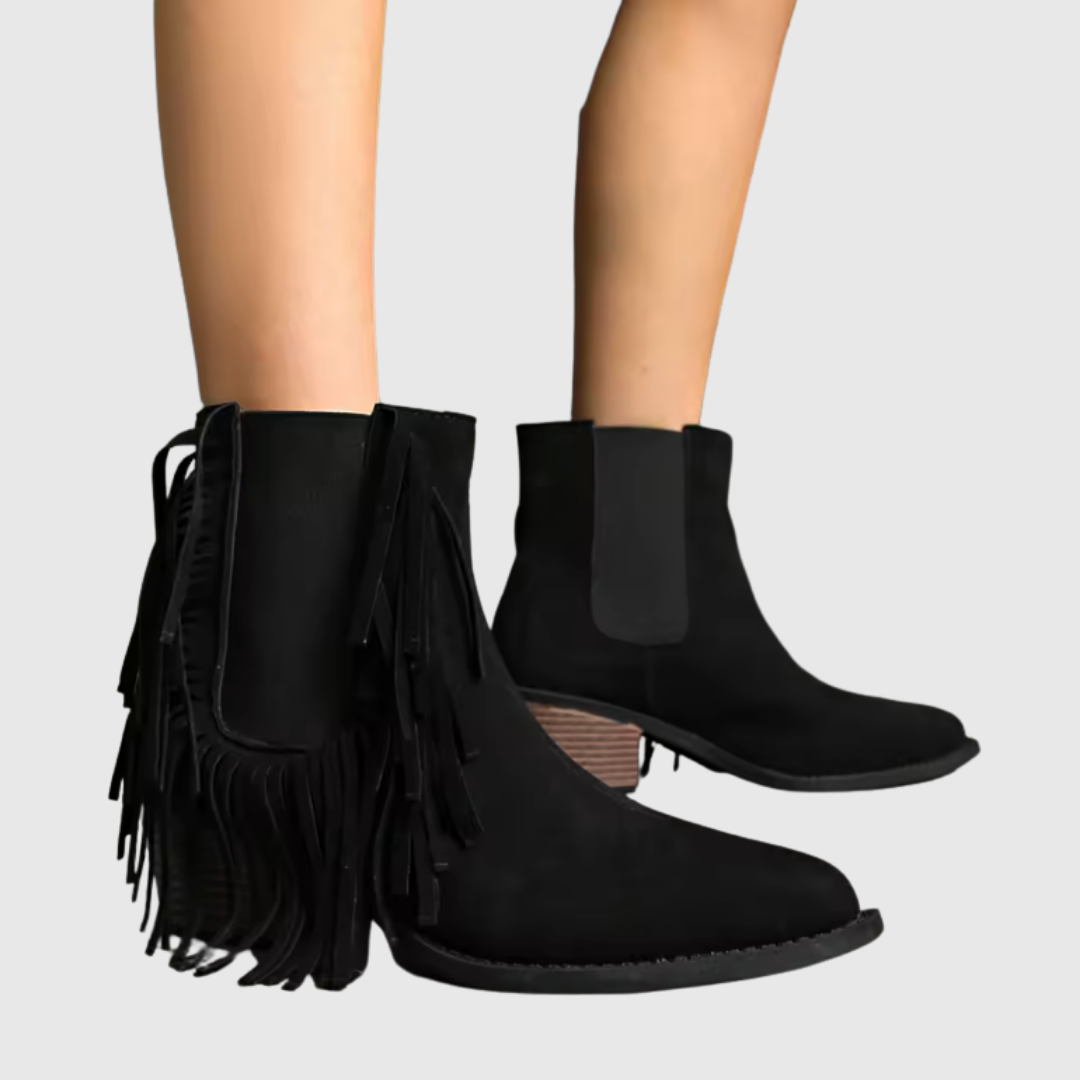 Olivine fringe ankle boots in black, worn side view