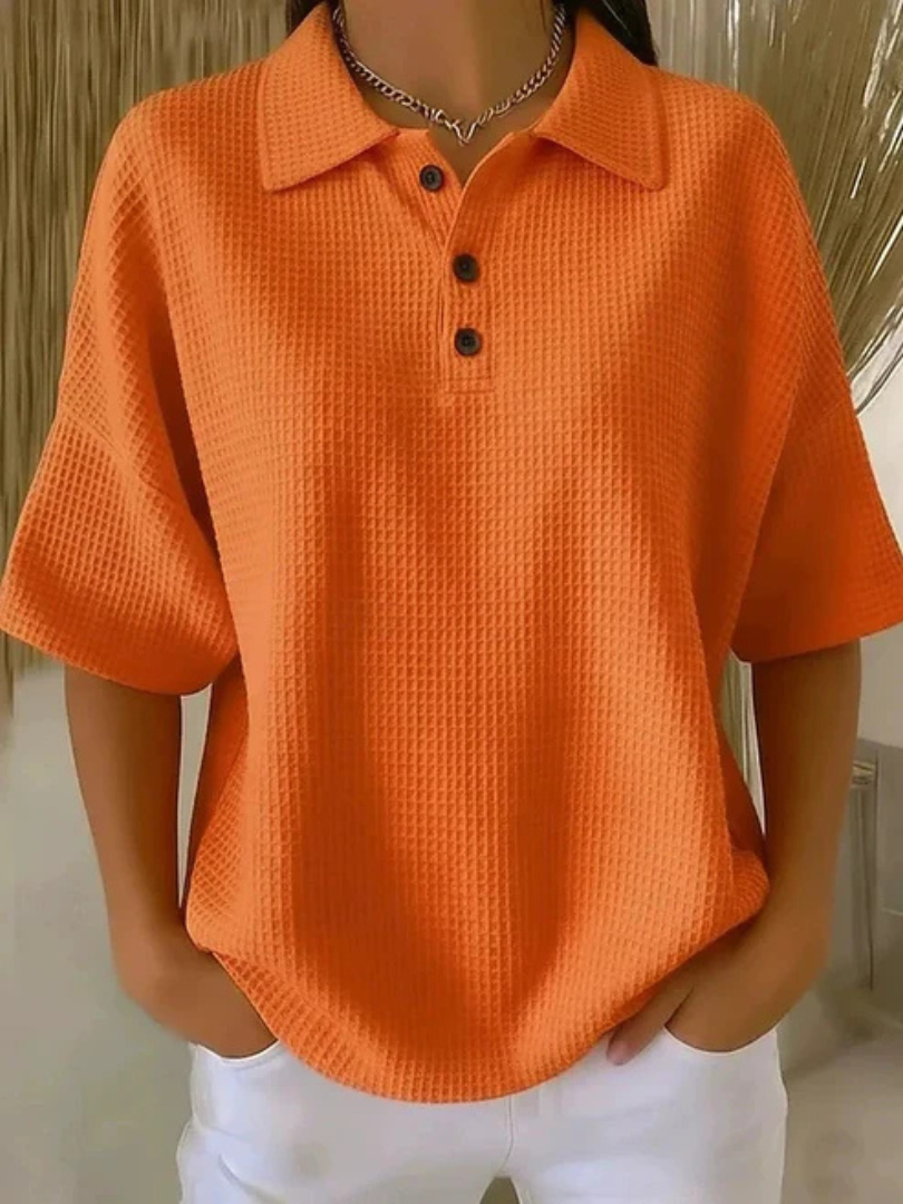 Peggie waffle polo blouse in orange, front view on model