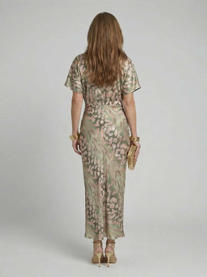 Coralie abstract print midi dress in green, back view with centre split