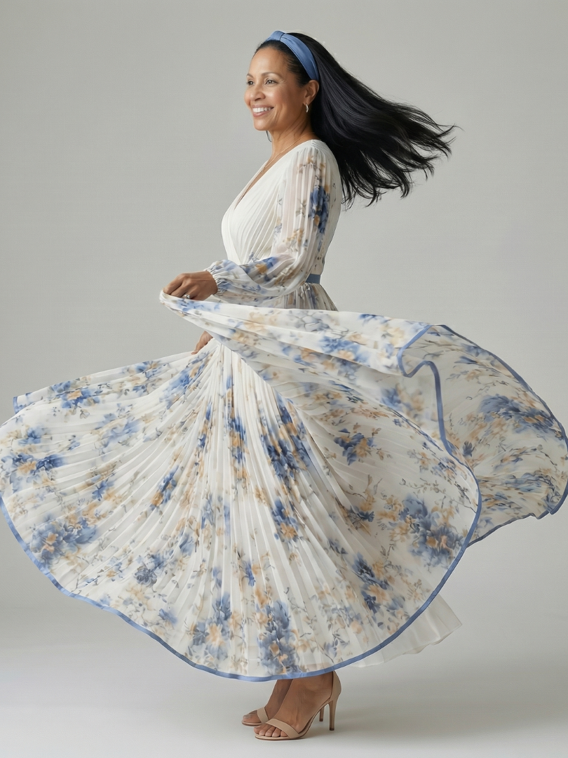 Rhiannon pleated floral wrap midi dress in white, pleated skirt twirling in motion