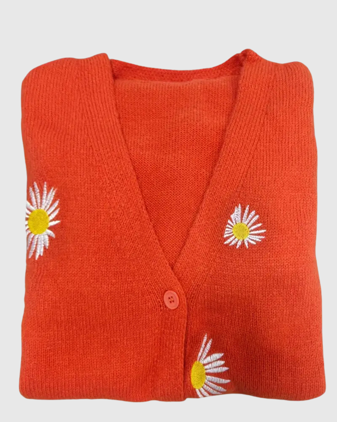 Irene knit cardigan in red, close-up of daisy motif and button