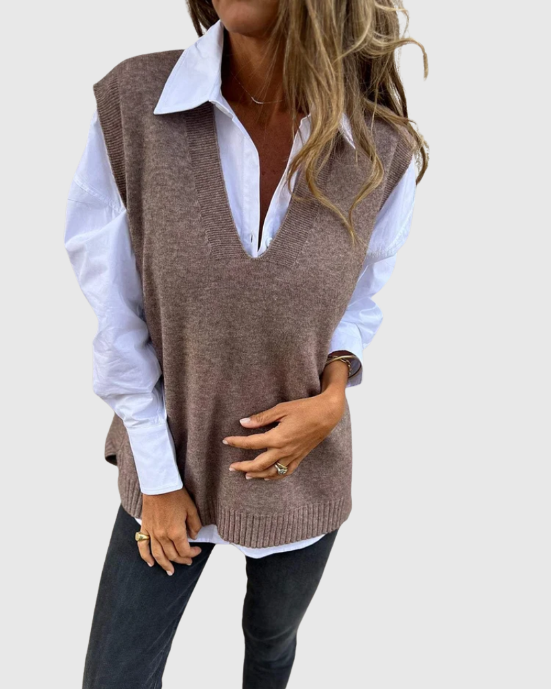 Nerelis knit sweater vest in grey brown, worn over a white shirt, front view