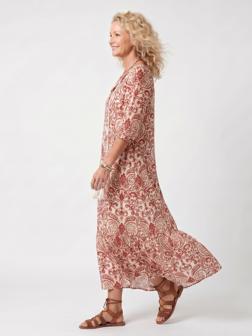 Noelle midi dress in red and cream, side view showing flowing hem