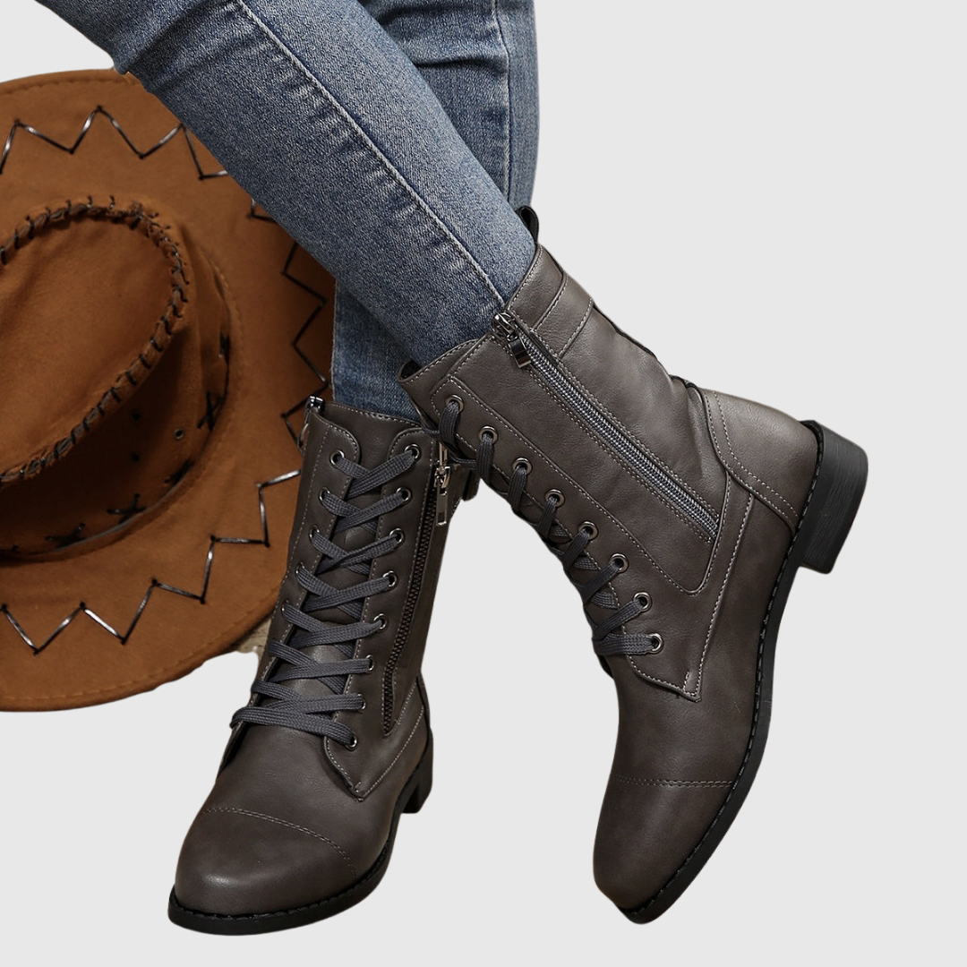 Carmine boots in grey, angled view showing block heel and sole