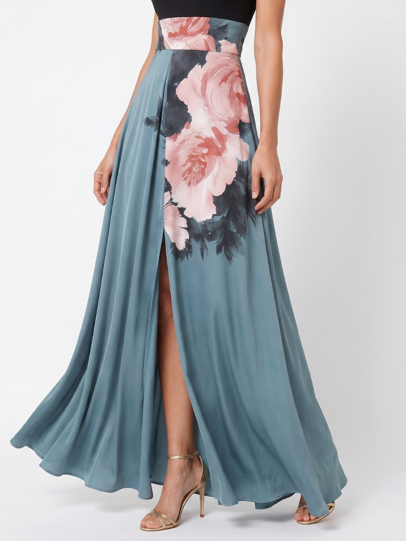 Close-up of Olympas dress skirt with pink rose print and front slit