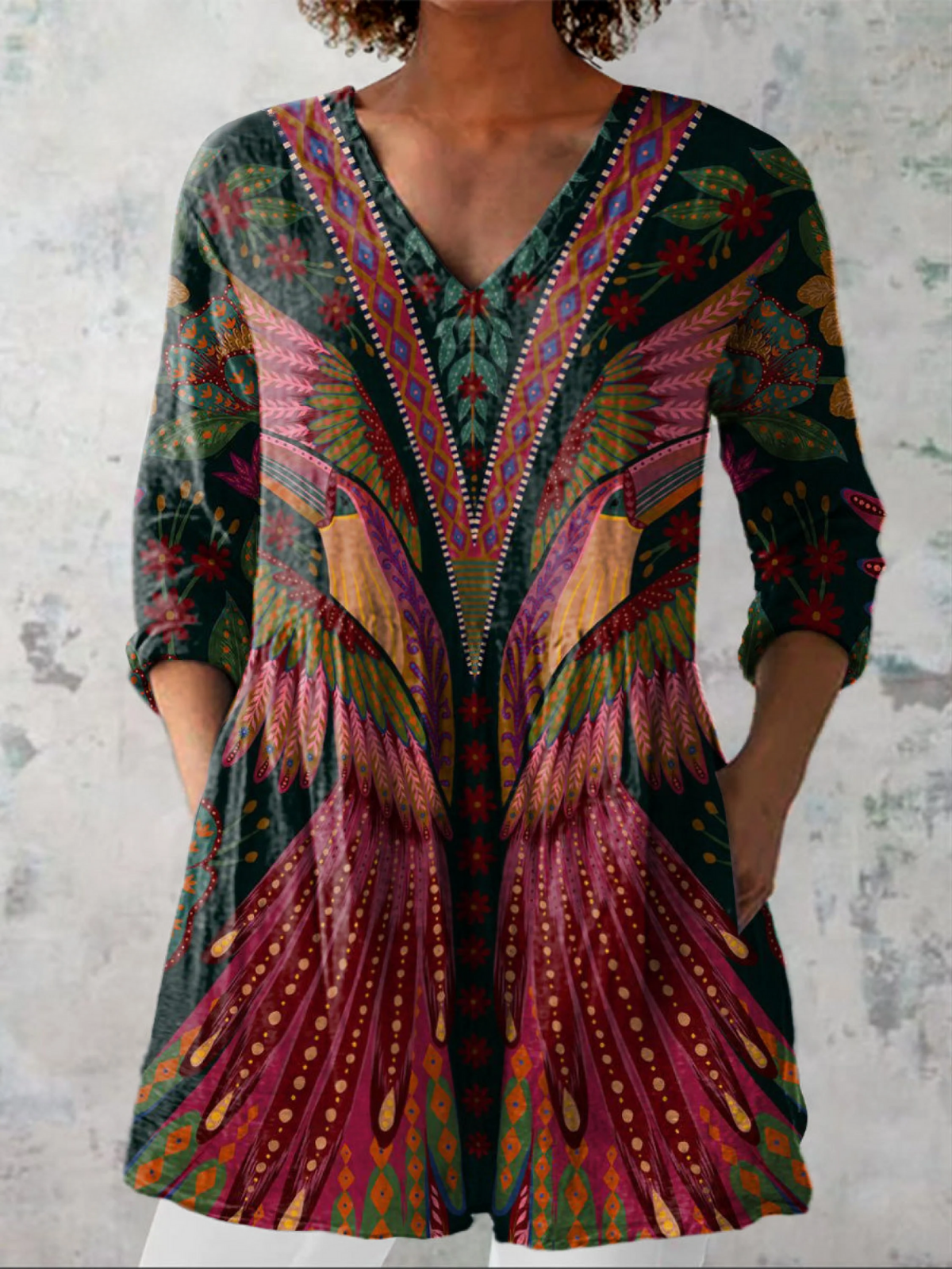 Manon long V-neck blouse in multicolour feather print, front view worn with white trousers