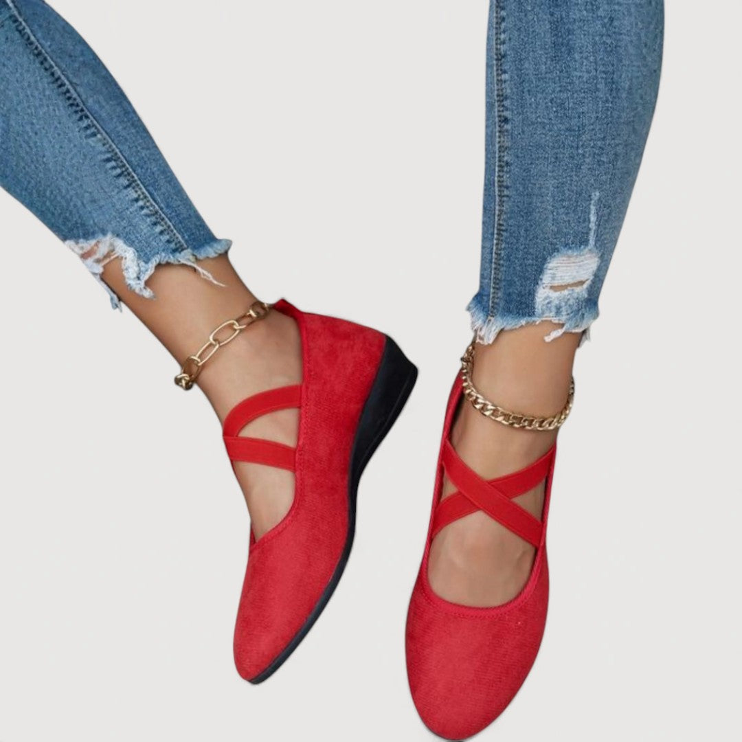 Vivienne flat ballet pumps in red, worn with blue jeans