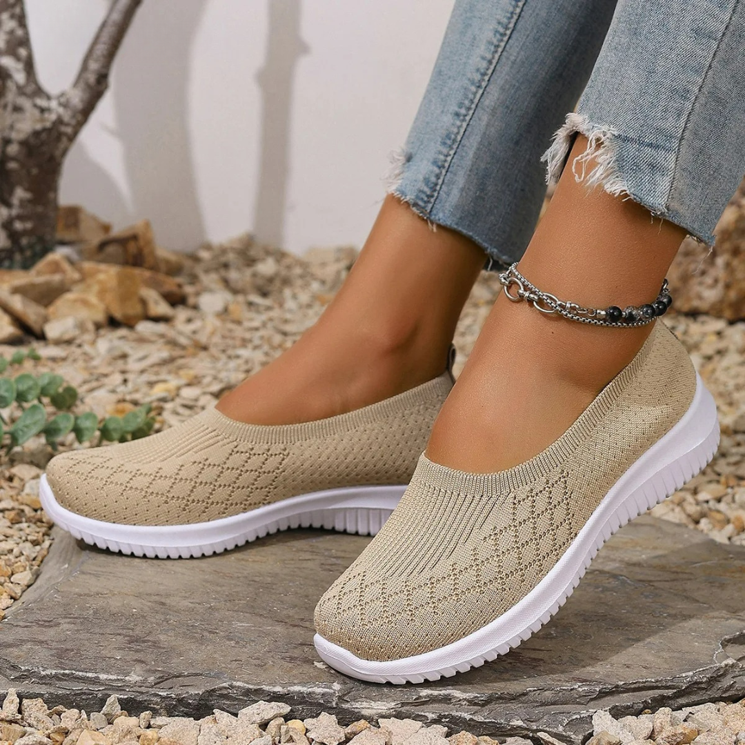 Estella slip-on shoes in khaki, worn with jeans, side view