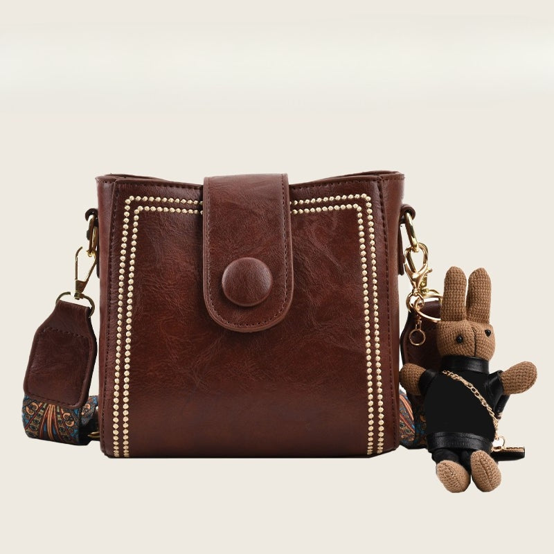 Ethel vintage shoulder bag in coffee brown, front view with studded panels