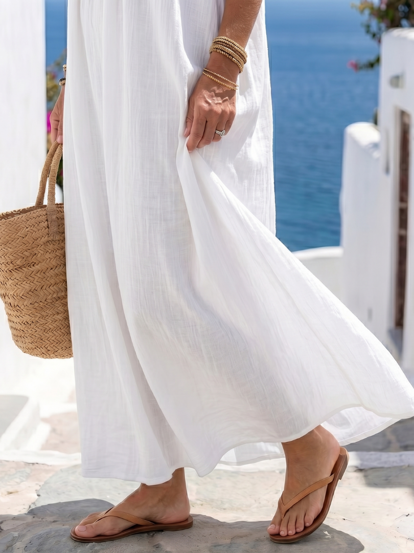 Keira maxi dress in white, close view of flowing skirt and hem