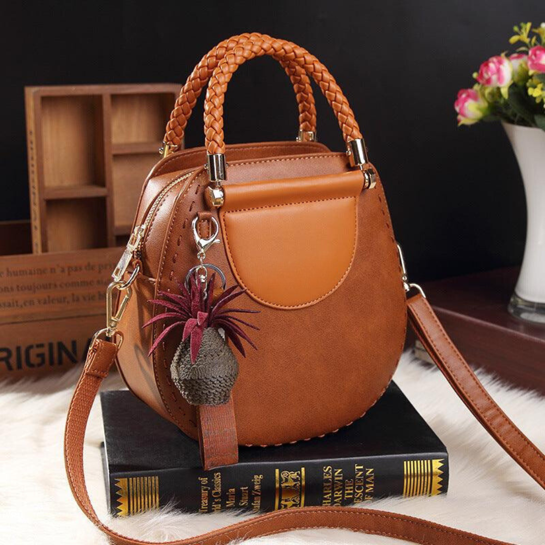 Naelle crossbody bag in caramel, angled view with long strap