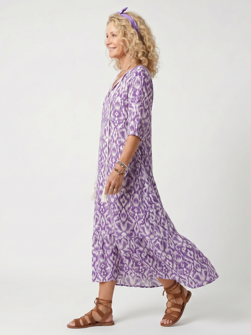 Penelope printed midi dress in purple, side view showing tiered hem