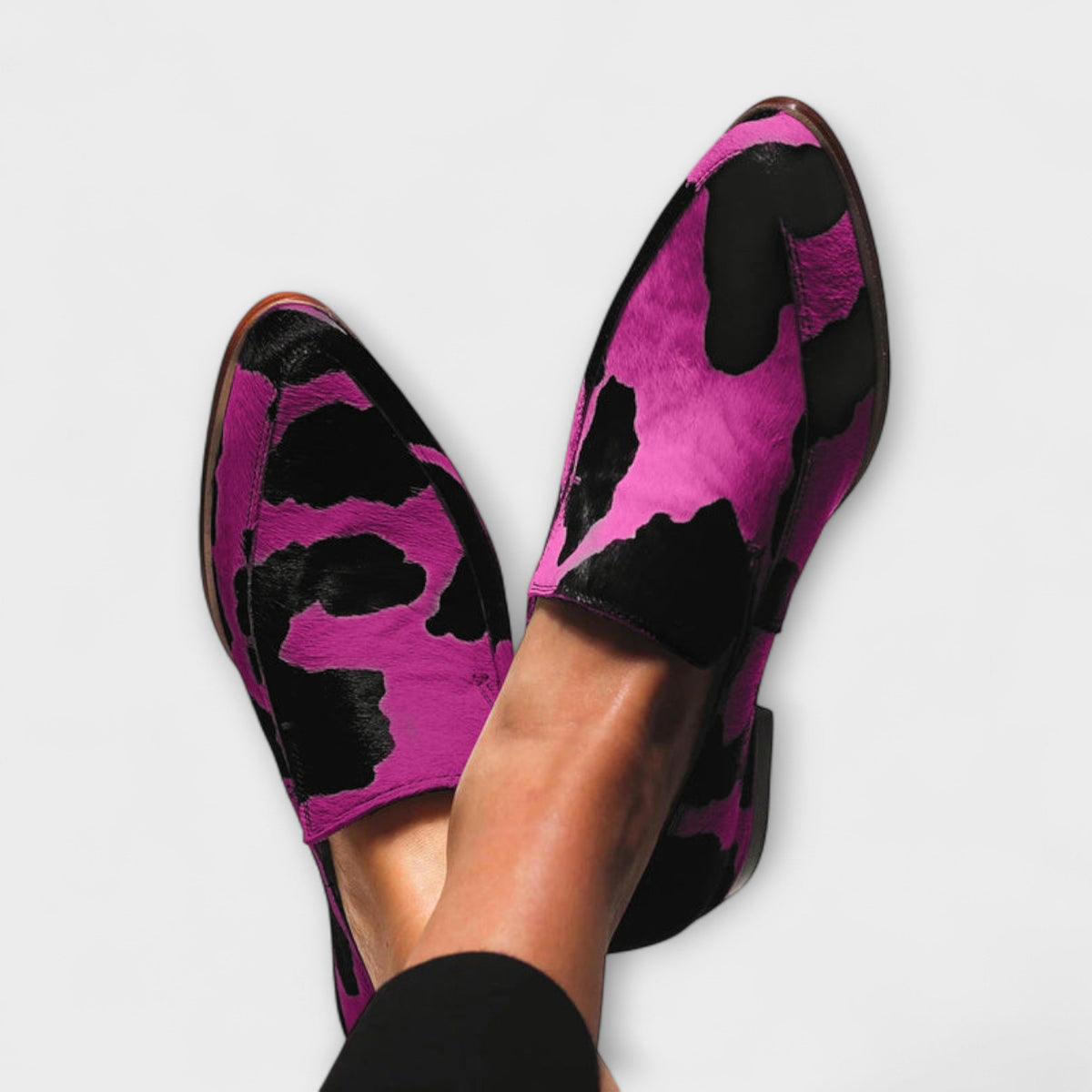Serena cow print loafers in fuchsia, close-up worn view
