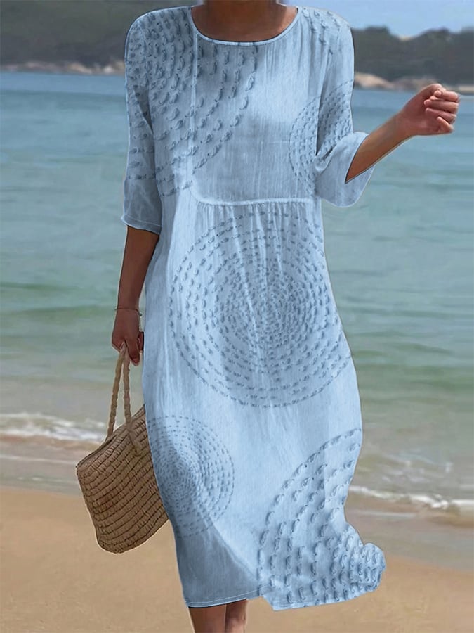 Light blue textured midi casual dress with circle pattern, full-length front view on the beach