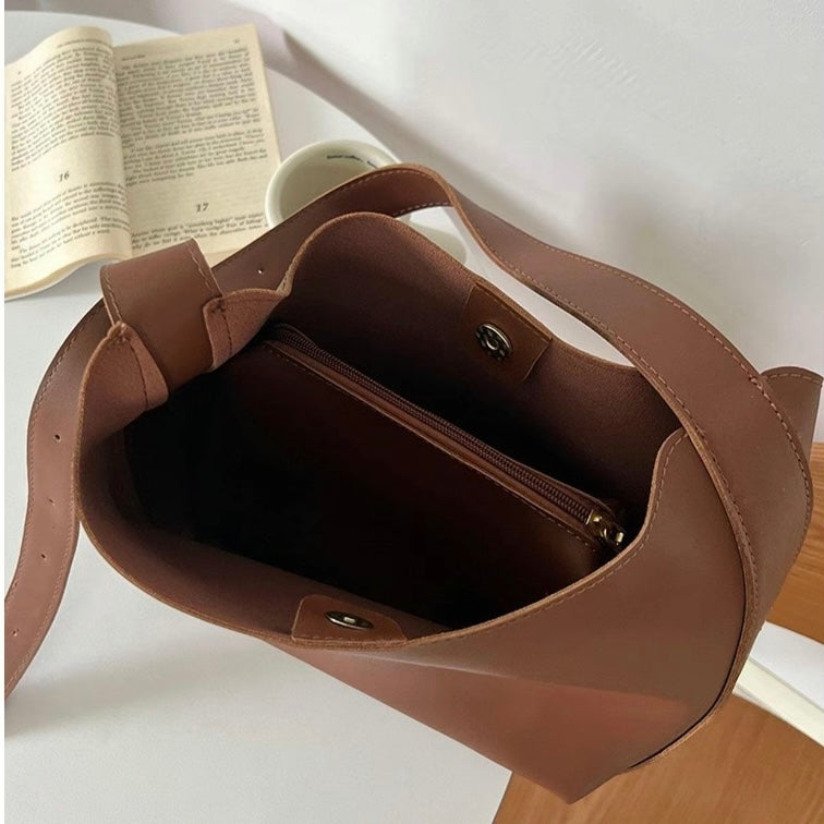 Isolde shoulder bag in brown, open view of zipped interior pocket