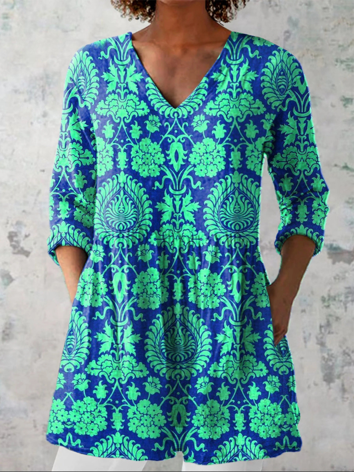Ines long V-neck blouse in teal with green damask print, front view