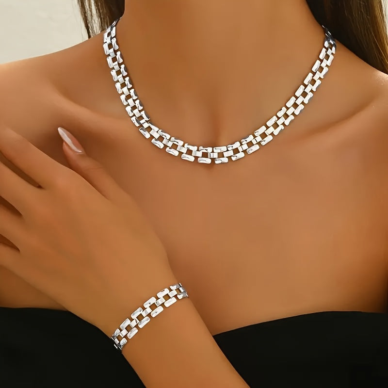 Square buckle necklace and bracelet set in silver, worn close-up