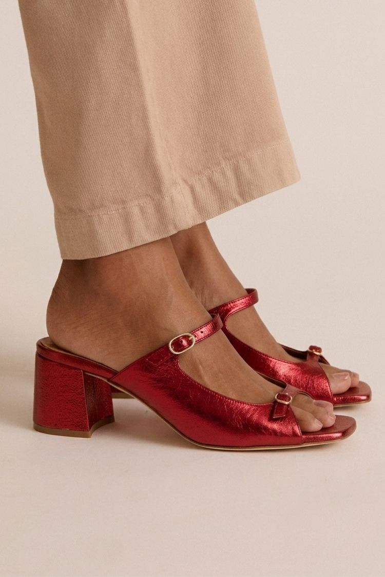 Valentina heeled sandals in metallic red, front angle on model