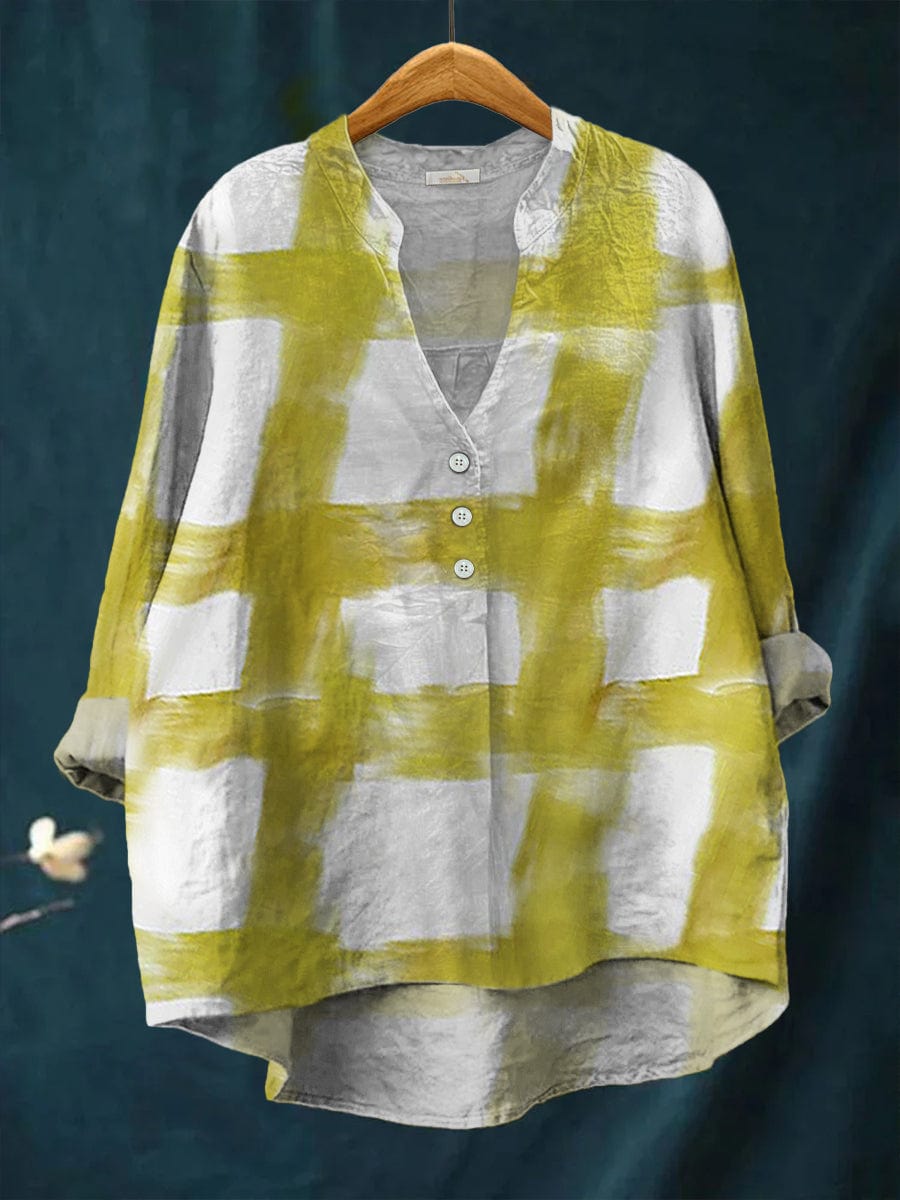 Odessa blouse in yellow and grey painterly check, front view on a hanger
