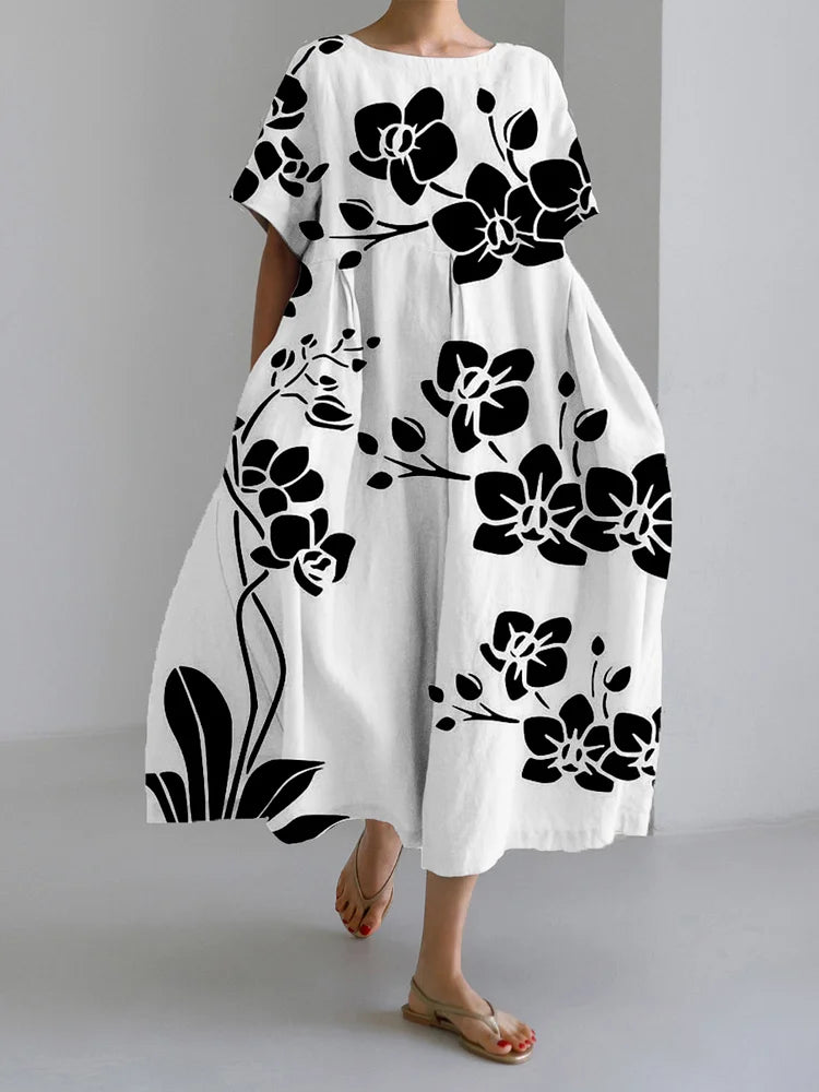 Augusta floral summer dress in white with black orchid print, full-length front view