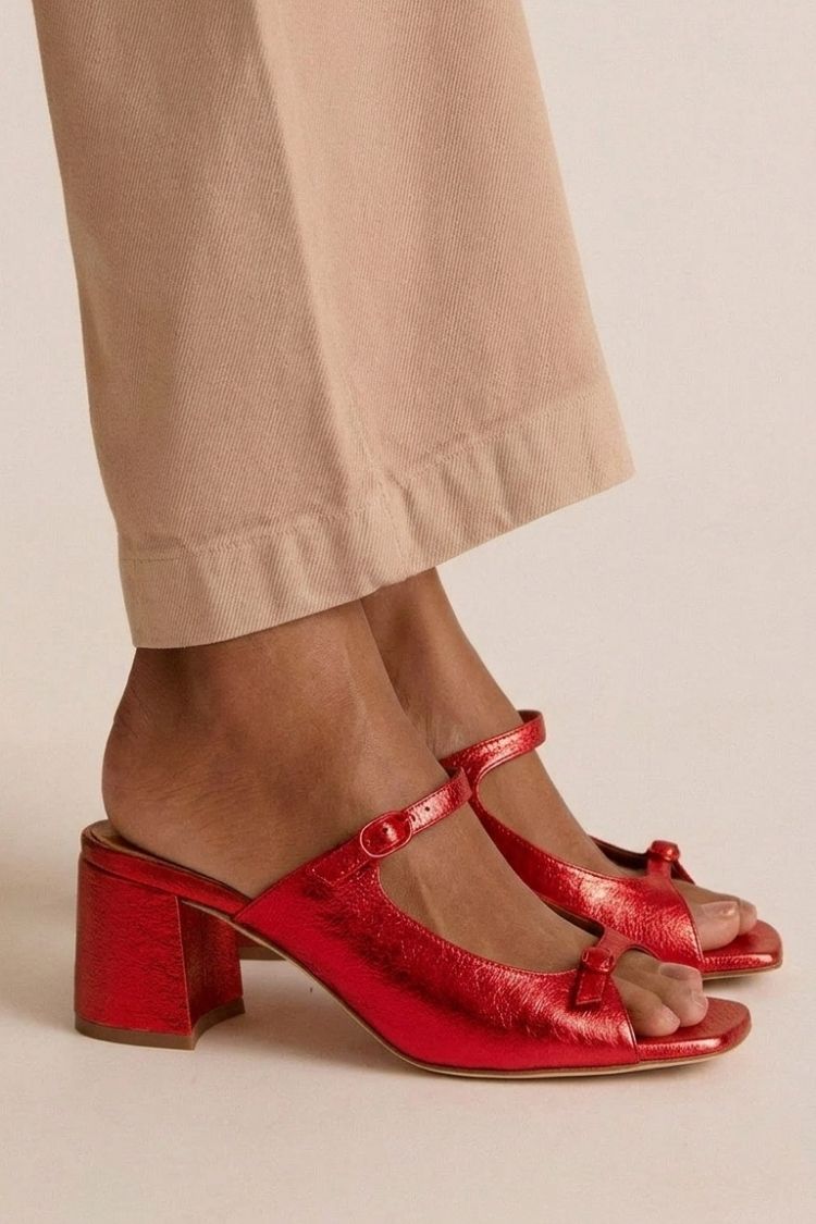 Valentina heeled sandals in metallic red, side view on model