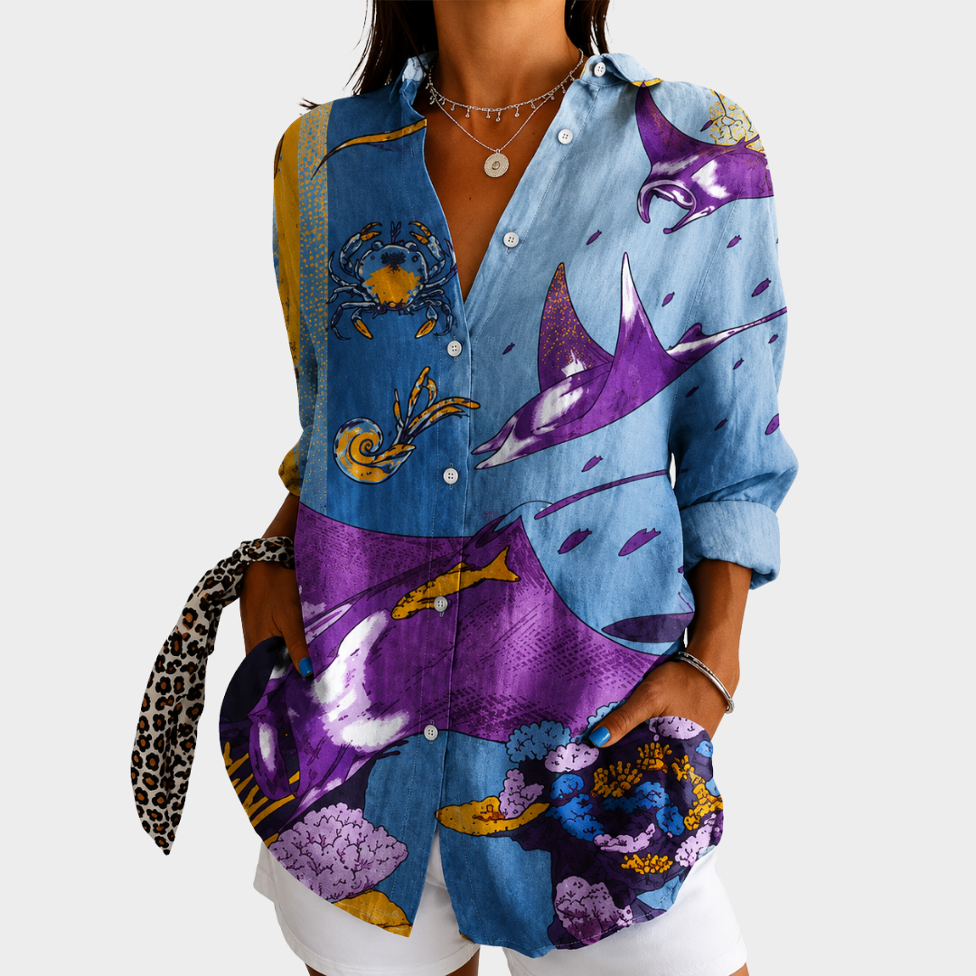 Ocean watercolour blouse in blue and purple print, front view worn with white shorts
