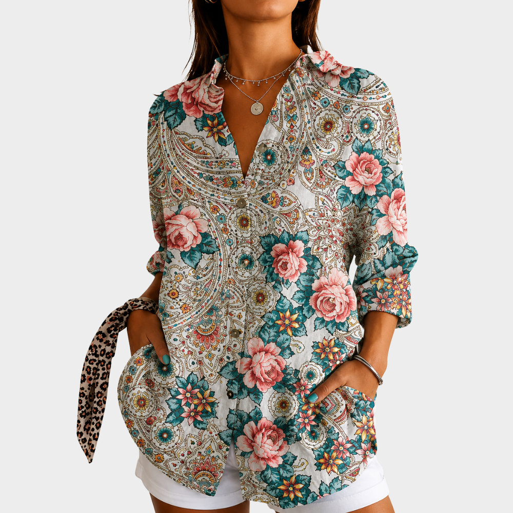 Roses and paisley blouse in cream, pink and teal, front view worn with white shorts