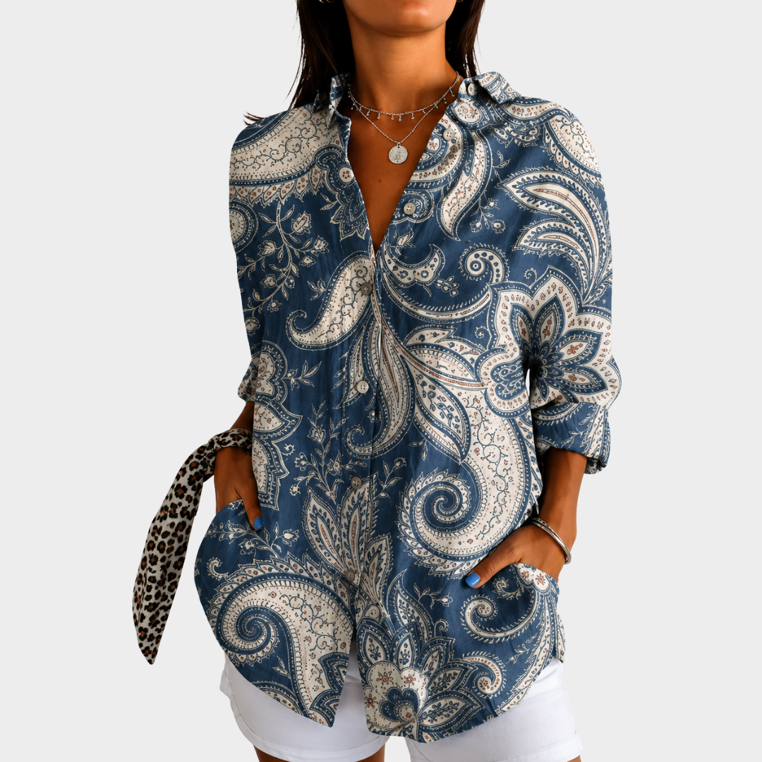 Coastal paisley blouse in blue and cream, front view worn with white shorts