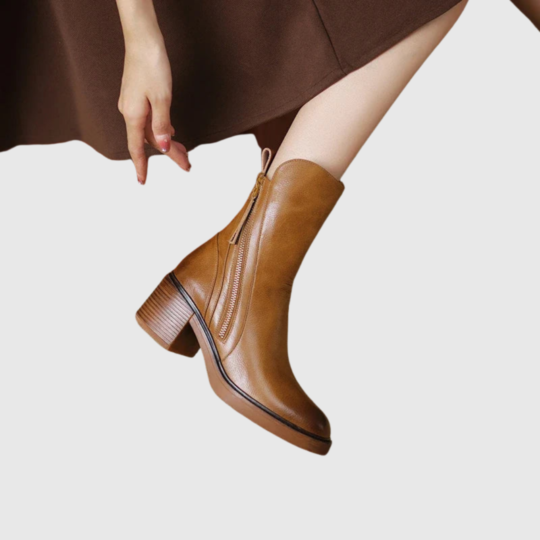 Streamlined ankle boot in brown, close-up of front zip detail